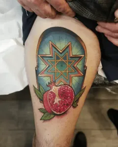 tatuaje-neotradicional-granada-y-estrella-de-ocho-puntas